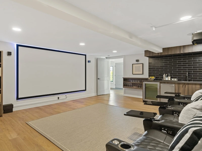 Home theater with projection screen and reclining seating