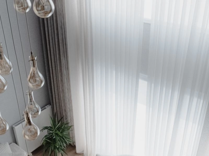 Sheer automated shades filtering daylight in a modern interior
