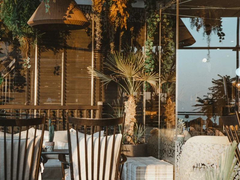 Shaded outdoor terrace with retractable awning and warm lighting