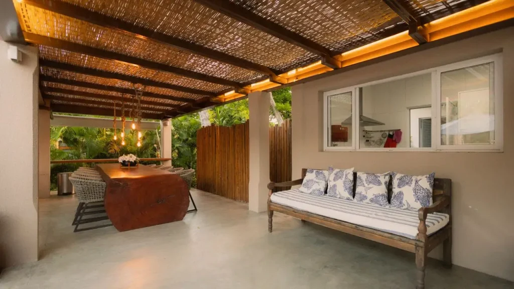 Retractable awning over a modern outdoor dining terrace