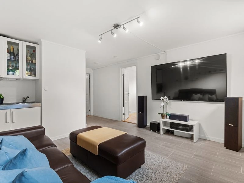 Home theater room with integrated speakers and AV equipment - Northwest Washington, DC