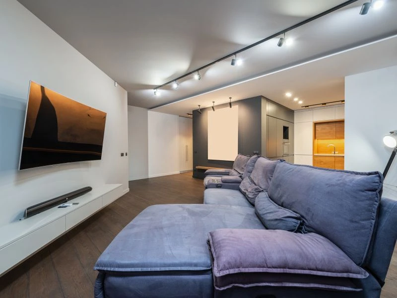 Home theater room with integrated speakers and AV equipment - Falls Church