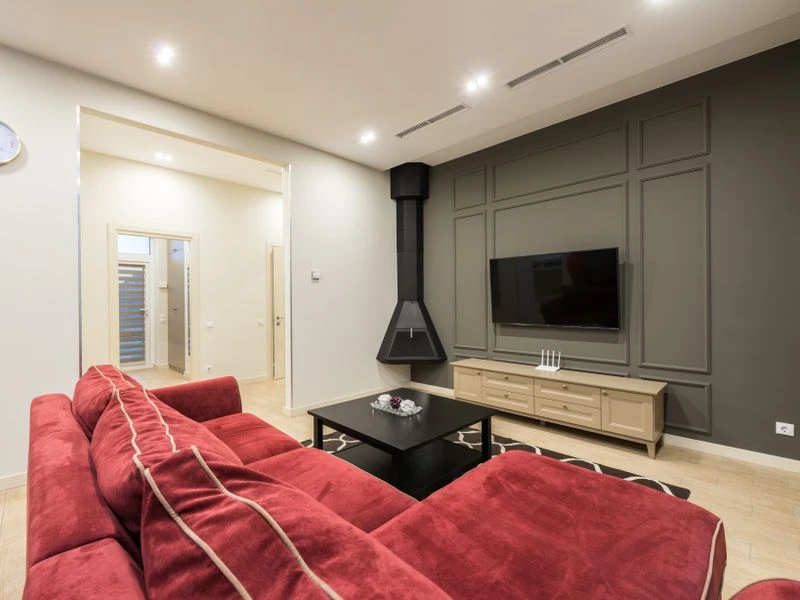 Home theater room with integrated speakers and AV equipment - Clifton, VA